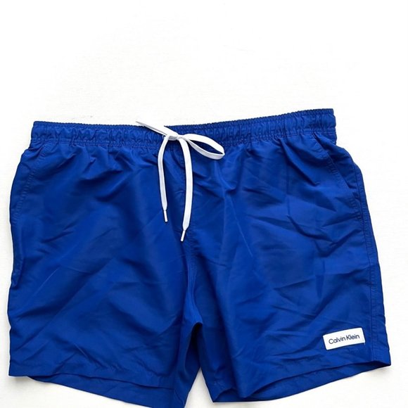 Calvin Klein CK  Logo Badge Solid Swim Trunk Blue - Picture 2 of 4